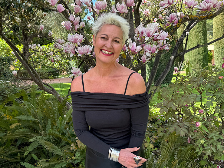 Myrto Mangrioti smiling during a coaching session, representing joy and transformation