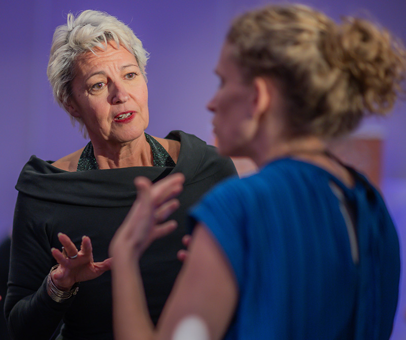 Myrto Mangrioti smiling during a coaching session, representing joy and transformation